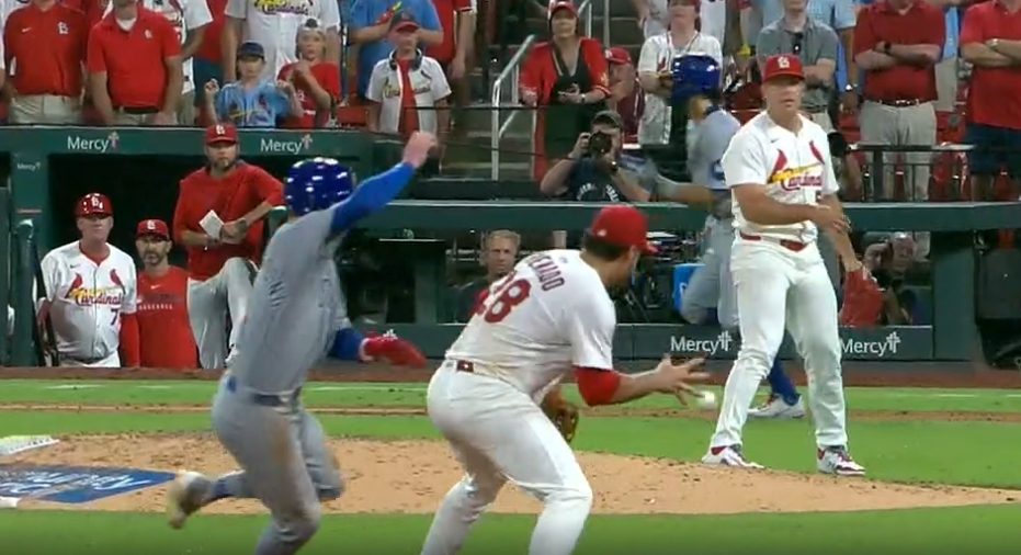 Nolan Arenado - 3a - Redbird Report Arenado about to barehand a ball and throw a runner out at first
