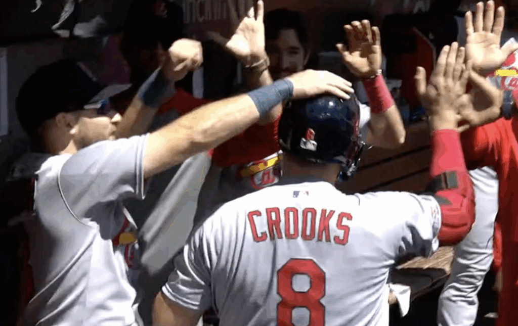 The Cardinals Dugout congratulating Jimmy Crooks after his first career hit and home run
